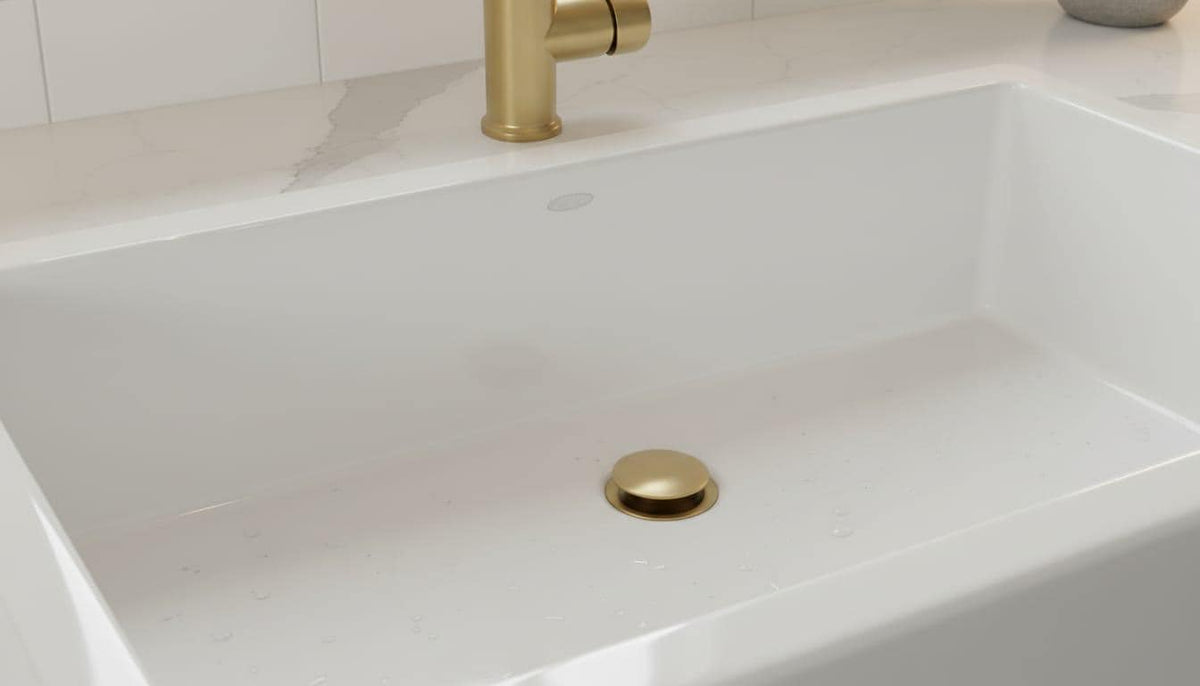 Unlacquered Brass Kitchen Sink Drain, Solid Pop Up Stopper – close-up of the finish